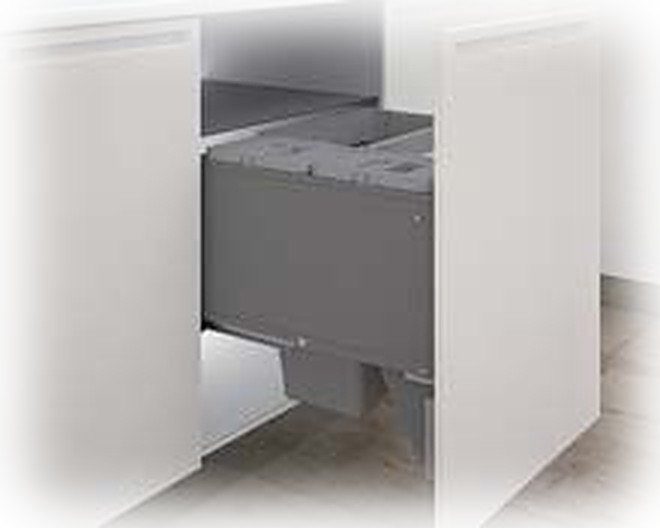 Inset drawer fitted behind a cabinet door