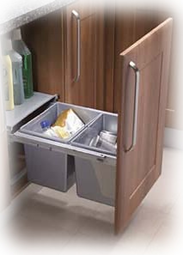 Twin grey 15 litre under-sink pull-out bins behind a timber kitchen door